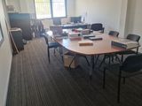 a room with a table and chairs in it