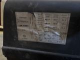 a close up of a parking meter with a sticker on it