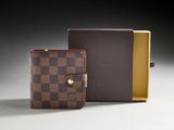 a close up of a wallet and a box on a table