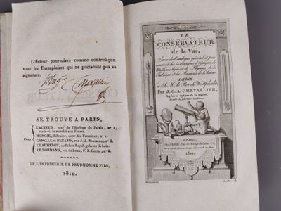 an open book with a picture of a man sitting on a bench in front of it