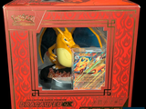 a dragon figurine in a red box on a black background