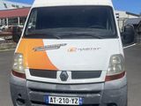 a white van with an orange stripe parked in a parking lot