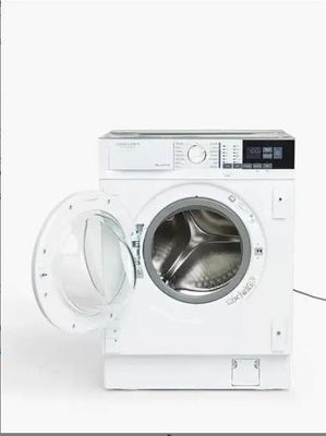 une photo d'une machine à laver dont la porte est ouverte