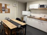 a small kitchen with a table and chairs in it