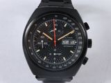 a close up of a watch on a white surface