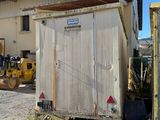 an image of a dump truck and a dumpster in a yard