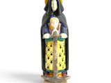 figurine of a woman holding a child in her arms