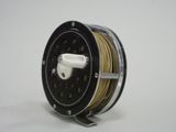 a reel that is sitting on a white surface