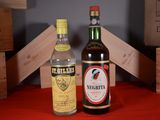 two bottles of liquor sitting next to each other on a table