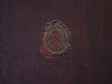 a small piece of wood that has a stamp on it