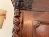 an image of a wooden door with a bird head on it