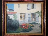 an oil painting of a house with a garden in front of it on a easel