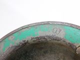 a close up of a metal bowl with a cat in it