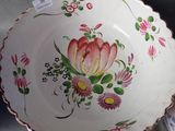 a plate with a flower design on it on display