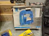 a box of tools sitting on a table next to a laptop
