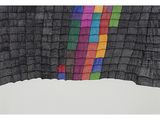 a close up of a multicolored piece of cloth on a white surface