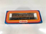 an orange and blue box with a train on top of it