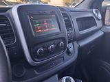 the interior of a car with a steering wheel and dashboard controls