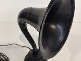 a black speaker that is sitting on a table