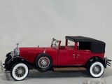a model of a red car with a black top