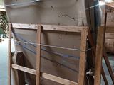 a pile of cardboard sitting on a pallet in a warehouse