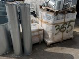 a pile of metal pipes and other items on the ground