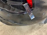 a sticker on the bumper of a car that has a sticker attached to it