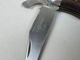 a knife that is laying on top of a table