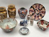 many different types of vases and bowls on the table