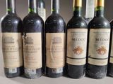 several bottles of wine are lined up on a table