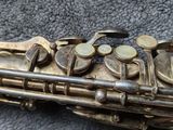 a saxophone that is laying on the floor