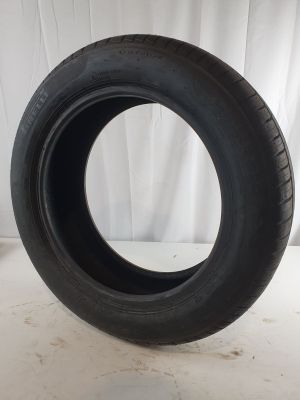 a close up of a tire on a white surface
