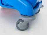 a blue suitcase with wheels on a white surface
