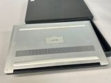 two laptops that are sitting on a table