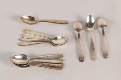 five spoons and two spoons sitting on a table