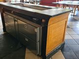 an image of a kitchen with a stove and a counter top