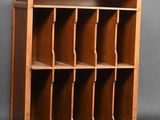 an old wooden bookcase with many shelves on it
