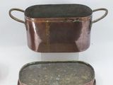 three pots and pans that are sitting on a table