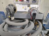 une image représentant une machine à laquelle est raccordé un tuyau