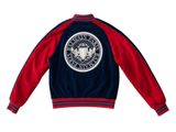 a close up of a red and blue jacket on a white background