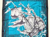 a close up of a square scarf with a ship on it