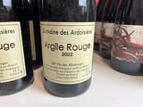 several bottles of wine are lined up on a table