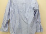a blue and white striped shirt hanging on a hanger