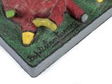 a cake shaped like a horse on a green plate