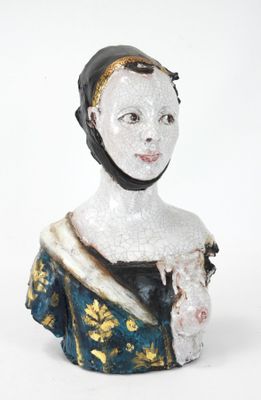 a figurine of a woman wearing a blue dress