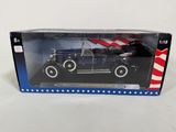 an old model car in a box with an american flag on it