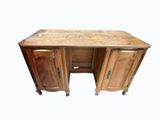 a wooden desk with two drawers and two doors