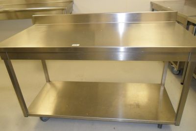 a stainless steel table with a shelf underneath it