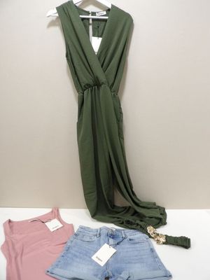 two women ' s clothing on a hanger next to a pair of shorts