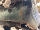 a close up of a car that has rust on it